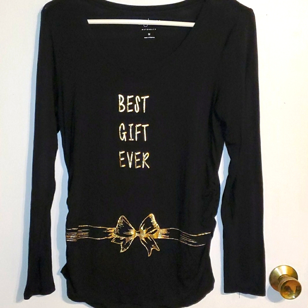 A-glow maternity shirt. Black with gold print bow around waistline